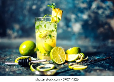 refreshment alcoholic cocktail drink at bar or pub. Gin and lime cocktail with pineapple and ice served cold by bartender
 - Powered by Shutterstock