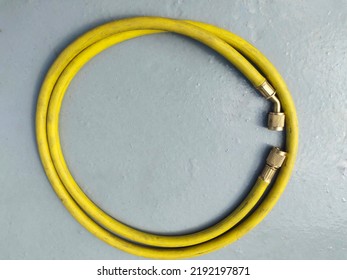 Refrigerant charging old hose. Yellow color Hose for gas charging on ac compressor.