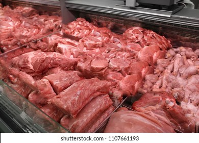 Refrigerated Display Case With Fresh Meat In Butcher Shop