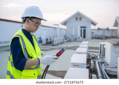 Refrigeration and Air Conditioning Engineering Detects Plant Cooling Problems,electrician maintenance Condensing on the rooftop outdoors of large industrial building,engineer under checking the indust