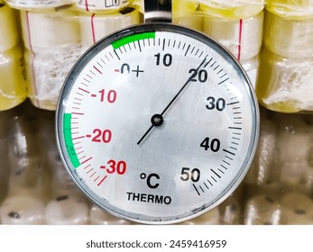 Refrigerator analogue thermometer in cold storage unit. Refrigeration safety gauge displaying safe medical laboratory temperature. - Powered by Shutterstock