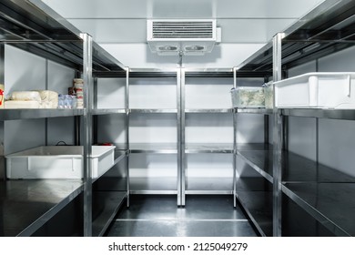 Refrigerator chamber with steel shelves in a restaurant