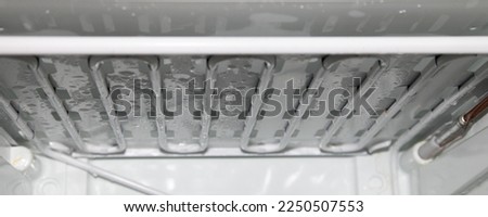 Refrigerator freezer evaporator tubes after defrosting