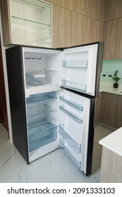 Refrigerator. Open Door Of An Empty Fridge. Household Appliances In The Store. Electrical Equipment And Household Goods. Kitchen Appliances.