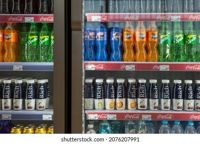 Refrigerator With Transparent Doors With Water, Popular Sweet Drinks And Juices. Front View. Close-up. Moscow, Russia, 10-28-2021.