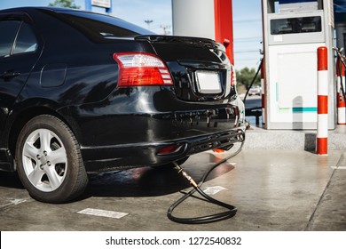 Refueling A Black Car AT Lpg Gas Filling Station