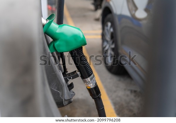 Refueling gasoline\
fuel for car at gas\
station