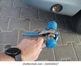 Refueling With LPG With A Filling Gun. Fuel Prices And Distribution. LPG Refueling Gun At A Petrol Station.