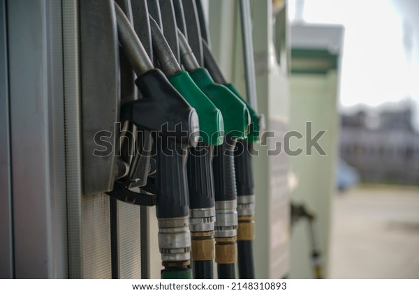 Refueling pistol at a\
gas station.\
Close-up.