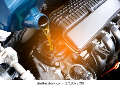 Refueling and pouring oil quality into the engine motor car Transmission and Maintenance Gear .Energy fuel concept.