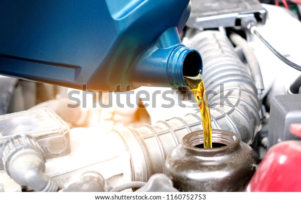 Refueling and
pouring oil quality into the engine motor car Transmission and
Maintenance Gear .Energy fuel
concept.