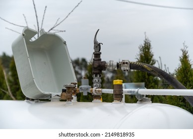 Refueling The Propane Gas Tank For Home Heating. Purchase And Price Of LPG. Tank For Gas Installation In A Single-family House.