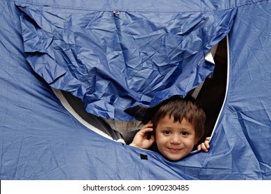 A Refugee Boy Sits In Tent In Victoria Square, Where Migrants And Refugees Stay Temporarily In Athens, Greece On Sep. 22, 2015.