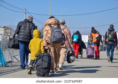 Refugees from Ukraine on the border with Slovakia. Women and children are fleeing the war in Ukraine. Volunteers on the Slovakia-Ukraine border are helping refugees. 