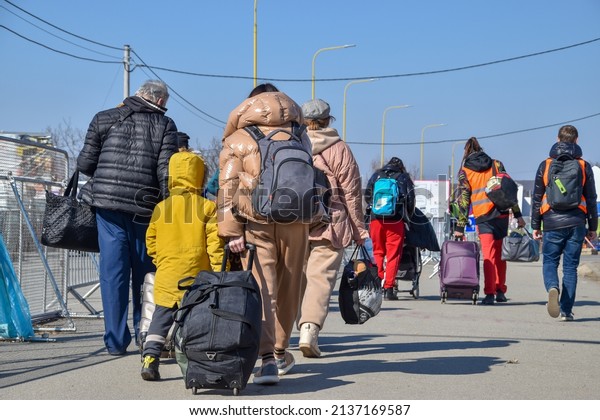 Refugees from Ukraine on\
the border with Slovakia. Women and children are fleeing the war in\
Ukraine. Volunteers on the Slovakia-Ukraine border are helping\
refugees. 