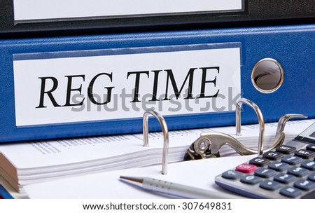Reg Time - blue binder with text on desk in the office