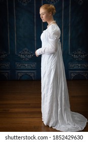 A Regency woman wearing a white muslin dress 