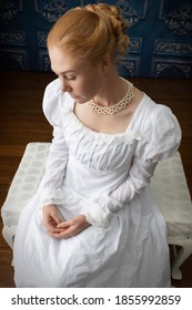 A Regency Woman In A White Muslin Dress Alone In A Room