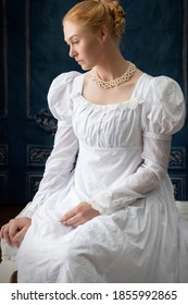 A Regency Woman In A White Muslin Dress Alone In A Room