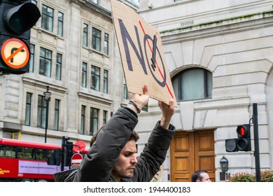 REGENT STREET, LONDON, ENGLAND- 20 March 2021: Protester Holding An Anti-vax Placard At The Vigil For The Voiceless Anti-lockdown Protest In London