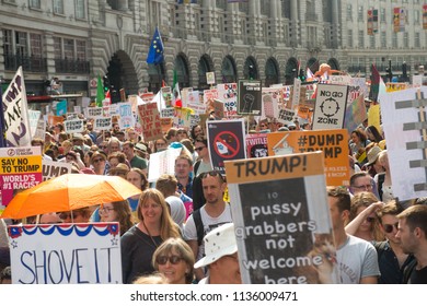 REGENT STREET, LONDON, UNITED KINGDOM. 13th July 2018. Demonstrators are seen in huge numbers holding posters during the protest against US President Donald Trumps visit to the UK 