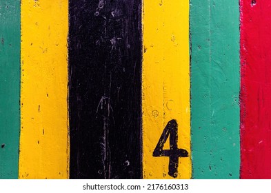 Reggae grunge Bar table in Rasta color in red yellow and green with wooden textured and no4. For Graphics Poster Background copy space. Rasta Reggae music Jamaica Style Concept.