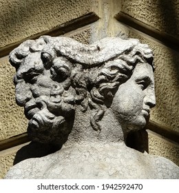 Reggio Emilia, Emilia Romagna, Italy - 03.01.2021: The two-faced statue of Janus on the corner of Palazzo Magnani