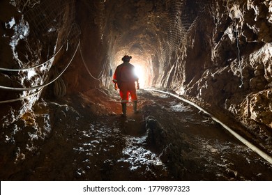 Region del Maule, Chile - Miner inside the access tunnel of an underground gold and copper mine.