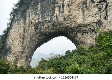 The region of Yangshuo is surrounded by irregular limestone formations of mesmerizing shapes, like this one, called Moon Hill. The village of Yangshuo itself is surrounded by this karstic formations