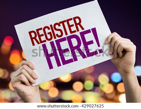 Register Here placard with bokeh background