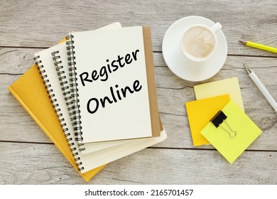 Register Online. Text Words On Paper On Yellow Laptop Office Desk And Glasses