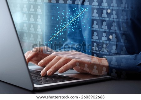 Regression analysis of customer behavior data. Statistical marketing analytics for effectiveness measurement and prediction. Marketer analyzing data with using laptop computer at desk in office.