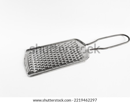 regular stainless steel grater isolated on white background.cheese grater utensil.