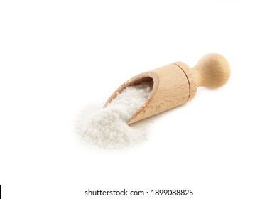 Regular Table Salt In A Wooden Spoon Isolated On White Background. Top View