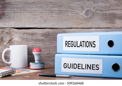 Regulations And Guidelines. Two Binders On Desk In The Office. Business Background