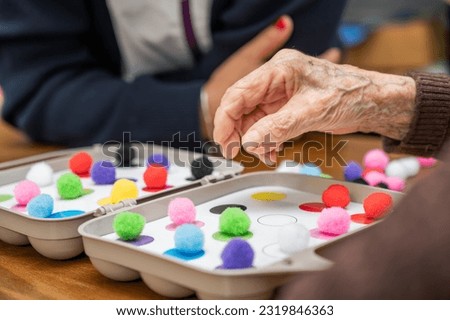 Rehabilitation center. Brain therapy cognitive psychological testing on senior patient. Alzheimer's disease and dementia prevention concept. Adaptation skills recovery. High quality photo