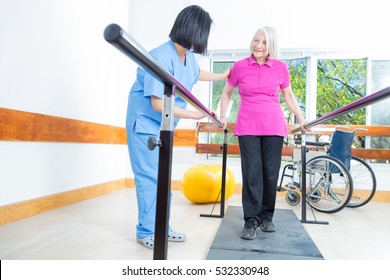 Rehabilitation Clinic With Elderly People And Nurse.