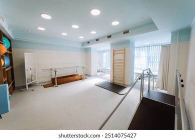 Rehabilitation room with parallel bars and equipment for physical therapy and mobility training - Powered by Shutterstock