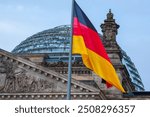 Reichstag building in Berlin, Germany, with the German flag flying.