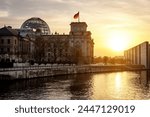 Reichstag building and bundestag district in Berlin - Germany during sunset