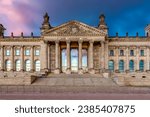 Reichstag building (Bundestag - parliament of Germany) in Berlin at sunset (translation "for German people")