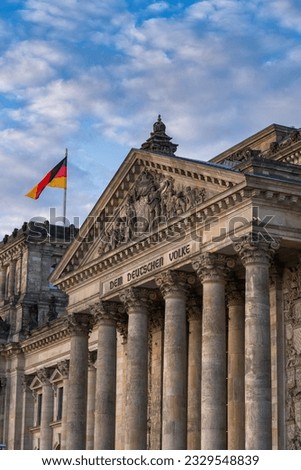 The Reichstag building pediment on Corinthian columns in city of Berlin, Germany. Neo-Classical architecture with entablature inscription 