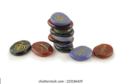 Reiki Healing Stones  - Three Different Colored Sets Of Reiki Healing Stones On A White Background