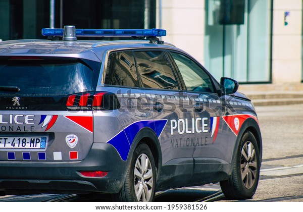 Reims\
France April 19, 2021 Police car rolling in the streets of Reims\
during the coronavirus outbreak hitting\
France