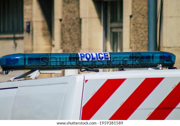 Reims\
France April 19, 2021 Police car rolling in the streets of Reims\
during the coronavirus outbreak hitting\
France
