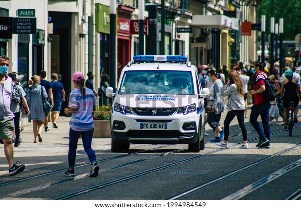 Reims France June 14, 2021 Police patrol enforcing\
social distancing in the streets of Reims during the coronavirus\
epidemic which hits\
France