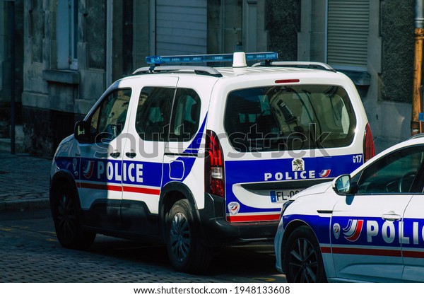 Reims France March 23, 2021 French\
police car in the streets of Reims during coronavirus pandemic and\
the lockdown to impose containment of the\
population