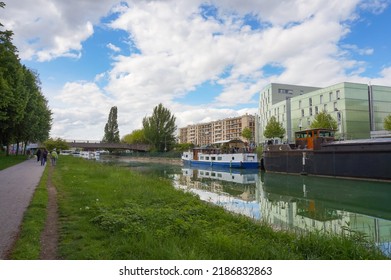 Reims, France - May 2021 - River boats berthed along the docks of Paul Doumer Boulevard, at the marina of the Vieux-Port (Old Port), on the Aisne to Marne Canal, a waterway crossing Champagne-Ardenne