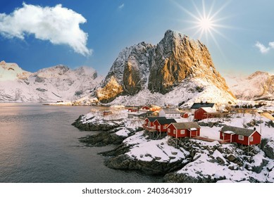 Reine, Lofoten, Norway. The village of Reine under a sunny, blue sky, with the typical rorbu houses. View from the top
