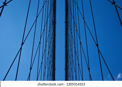 The reinforced steel cables of New York's iconic and historic Brooklyn Bridge. - Powered by Shutterstock